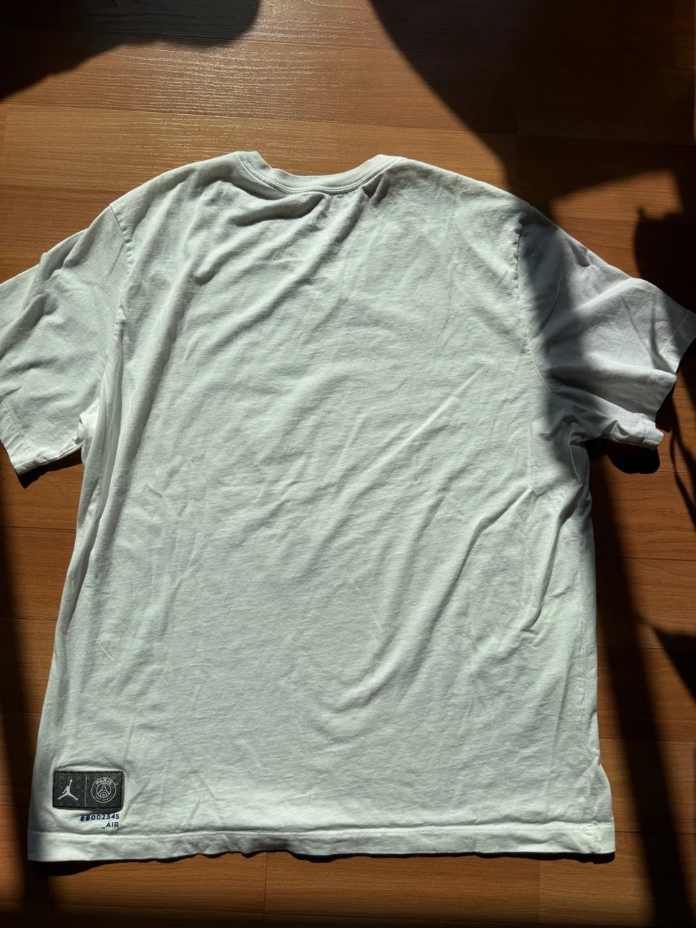 Jordan White Short-Sleeve Tee with Blue PARIS Graphic